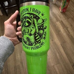 Neon green racoon tumbler